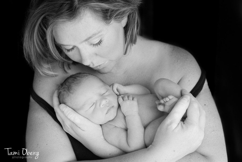 mom holding newborn baby