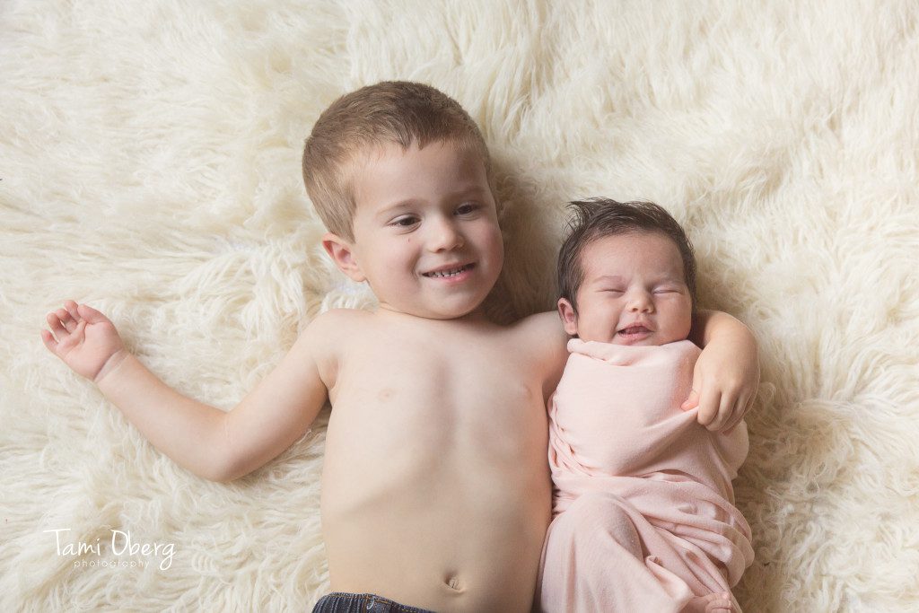 big brother with newborn baby sister
