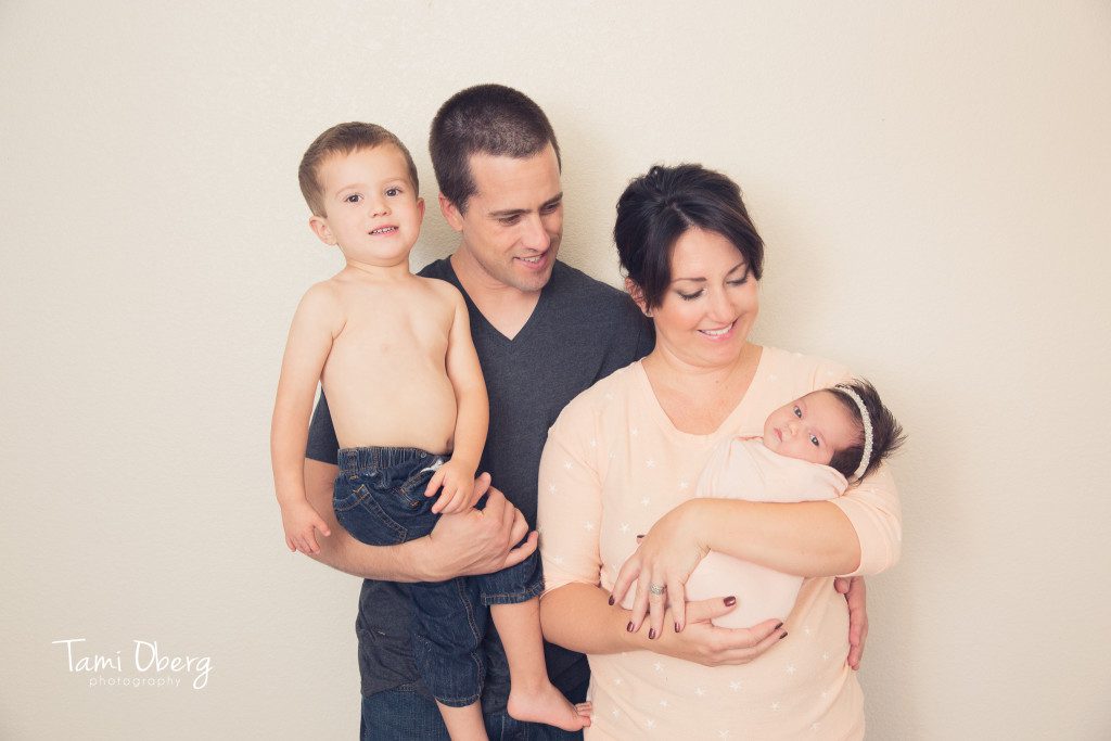 newborn with family