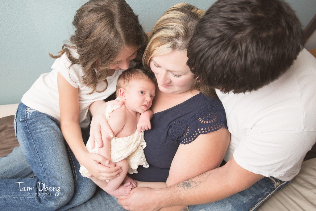 family with newborn baby girl
