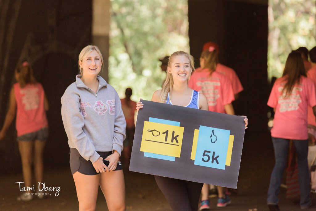 woman holding a 5k sign