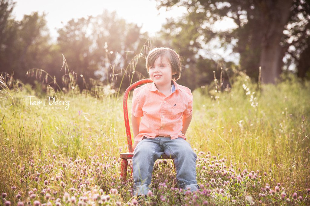 toddler in a red chair