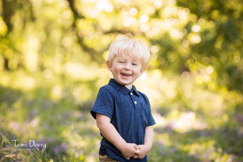 blonde little boy laughing