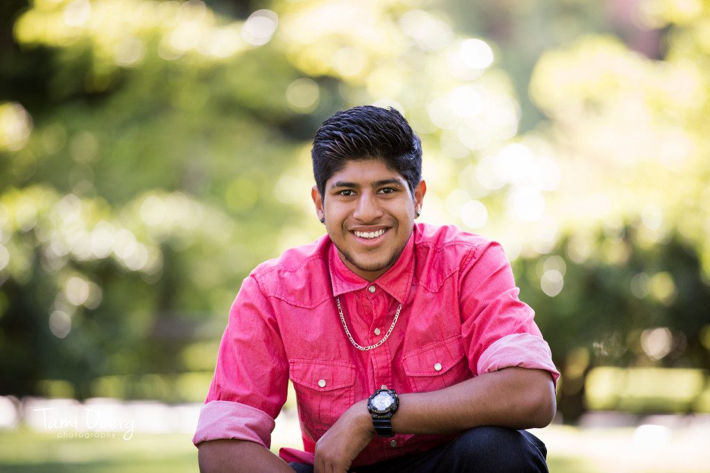 Senior boy with elbow on knee