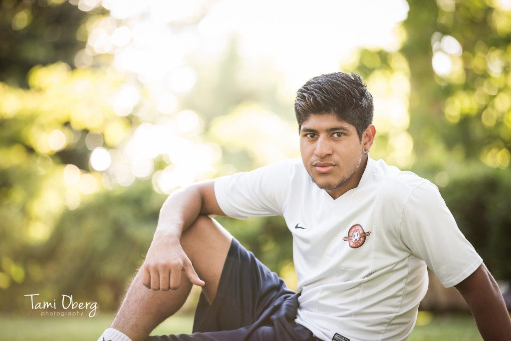 senior boy in soccer uniform