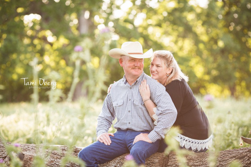 couple looking at each other on a log