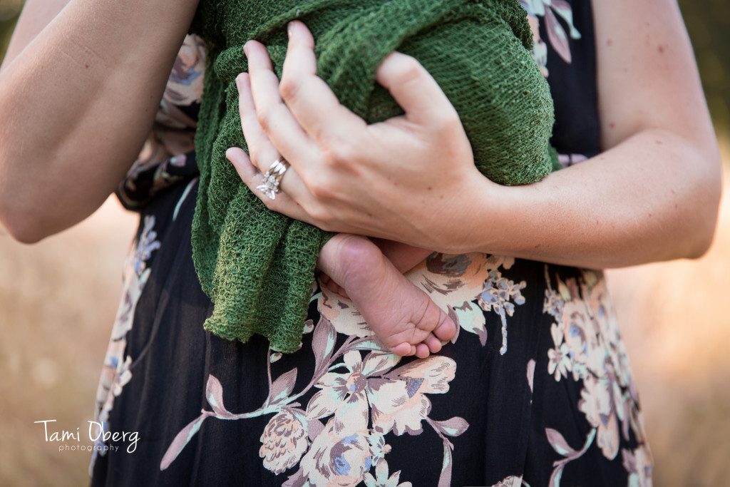 little baby feet peeking out from under a blanket