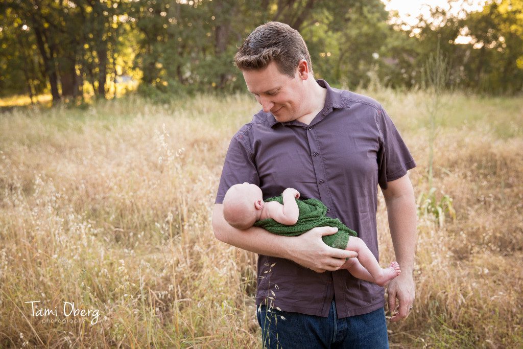 dad looking down at his son