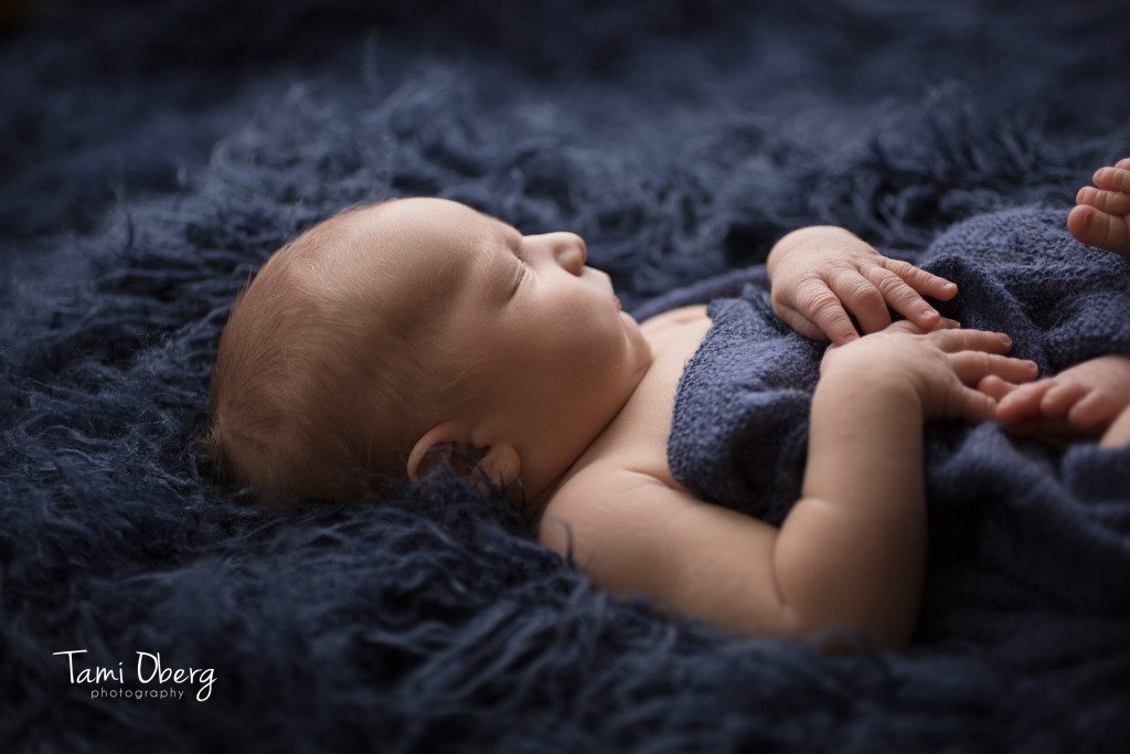 backlit flokati picture of a newborn baby