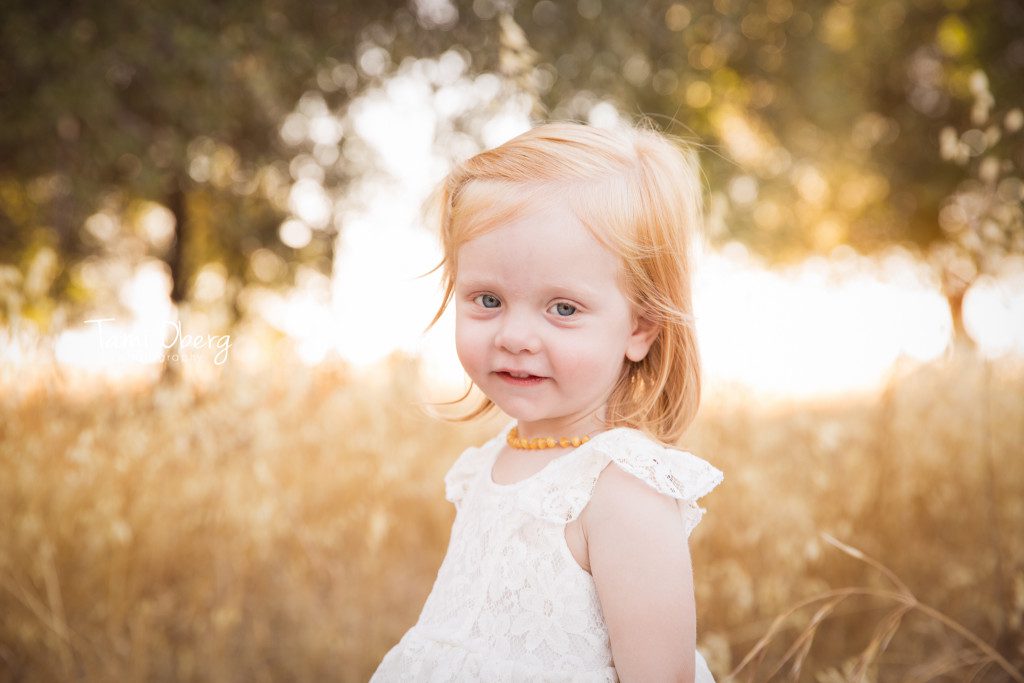 toddler girl in a field