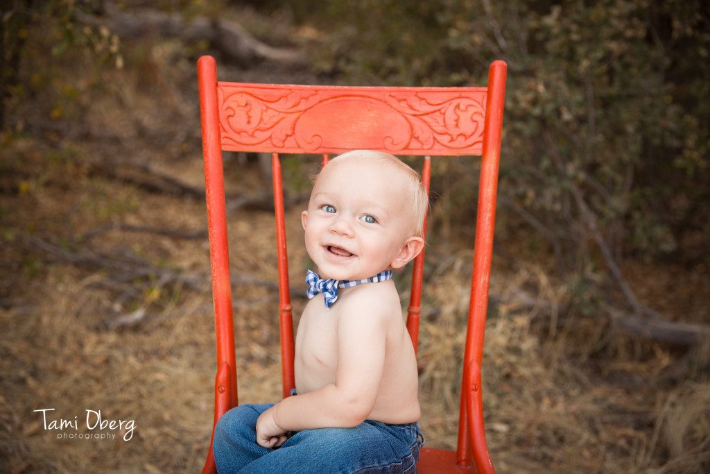 little boy on an orange chair