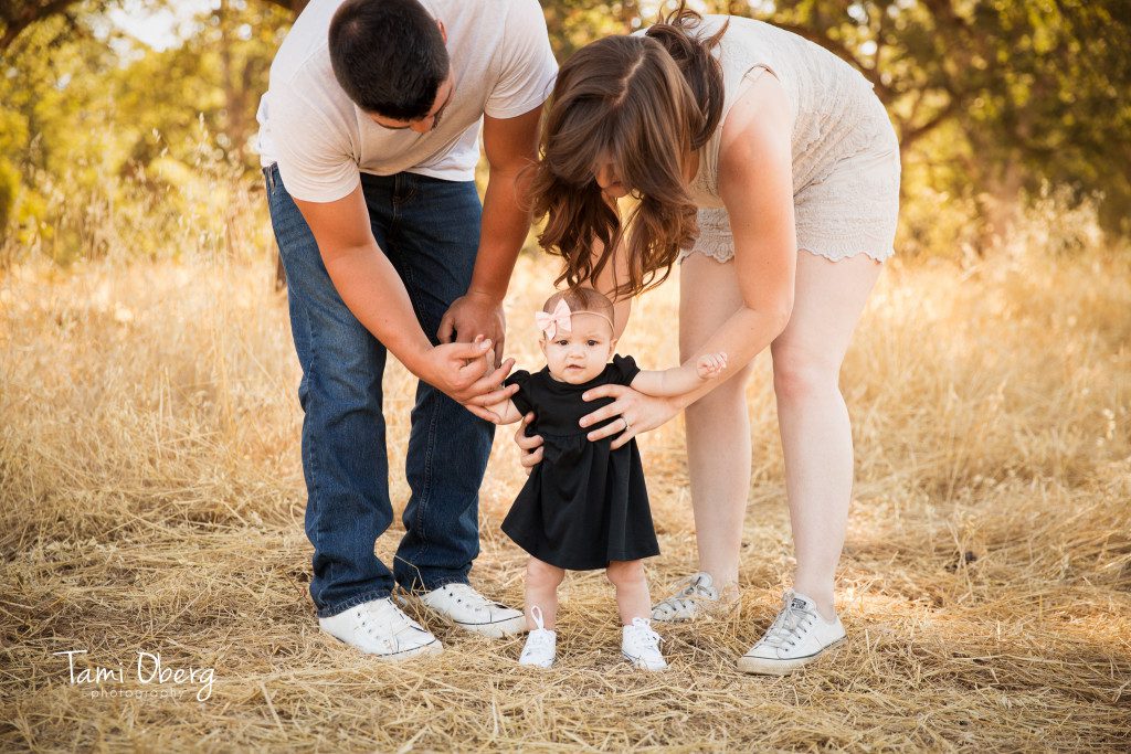 family with baby wearing Converse tennis shoes