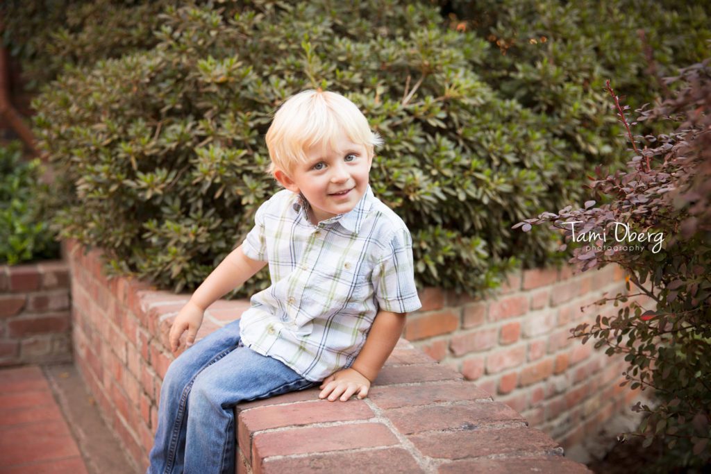 blonde little boy making a silly face for the camera