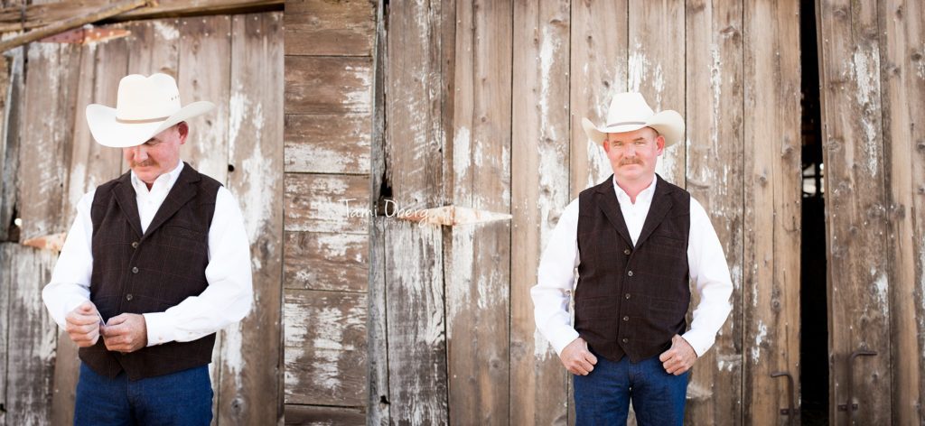 groom in front of old barn door