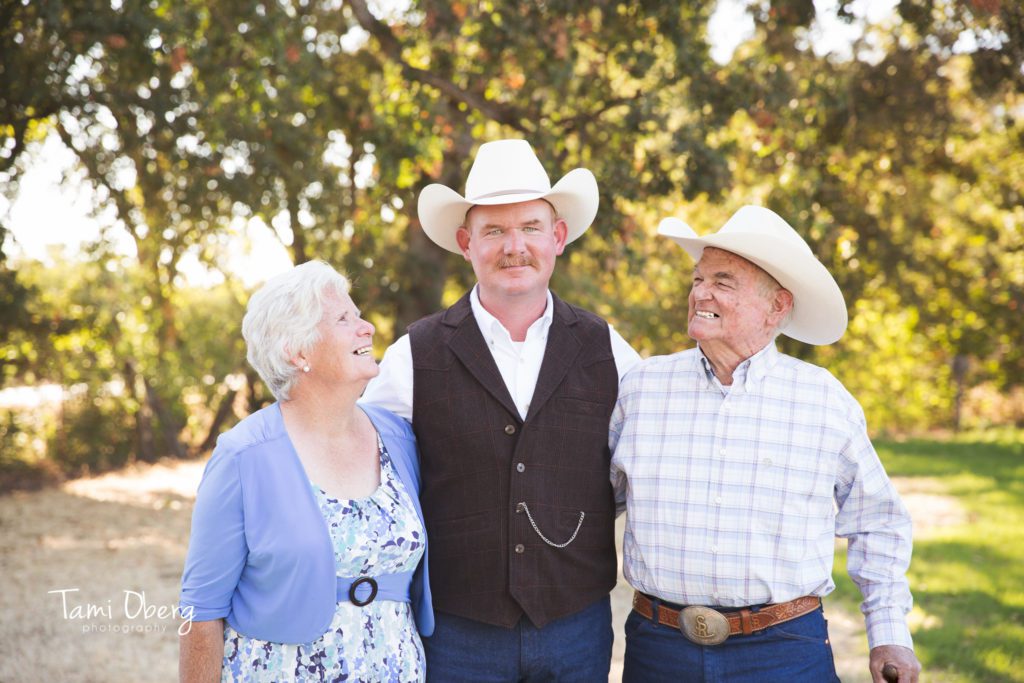 groom and his mom and dad looking at him