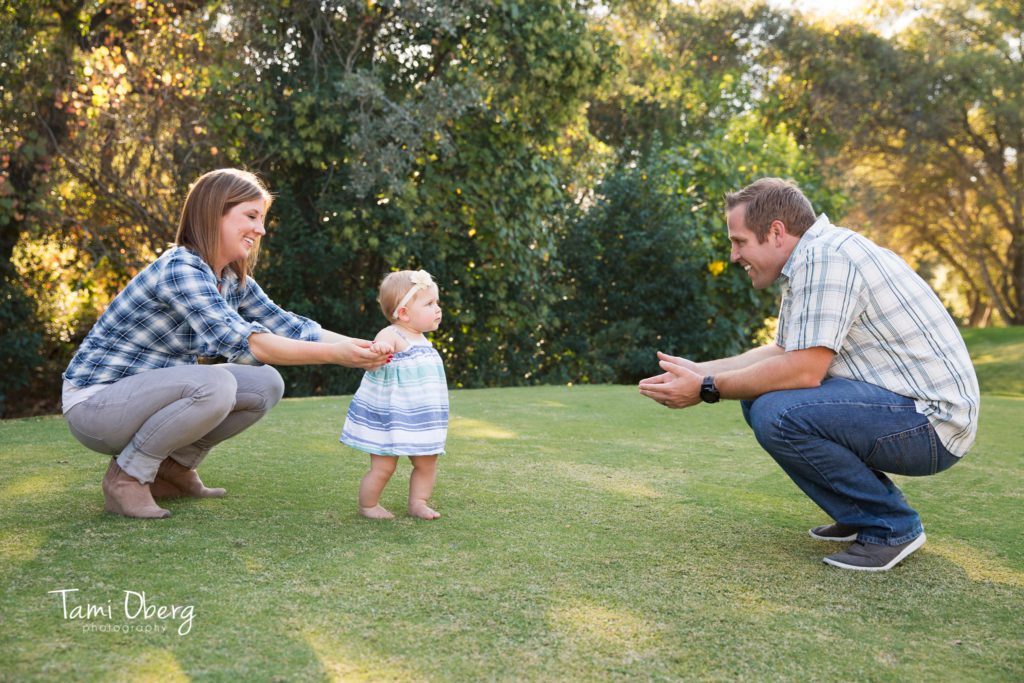 one year old walking from mom to dad