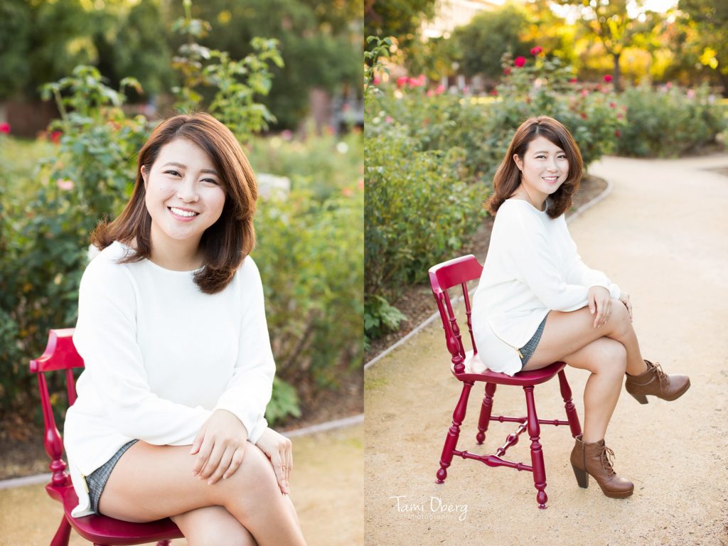 girl posing on a red chair in a white shirt
