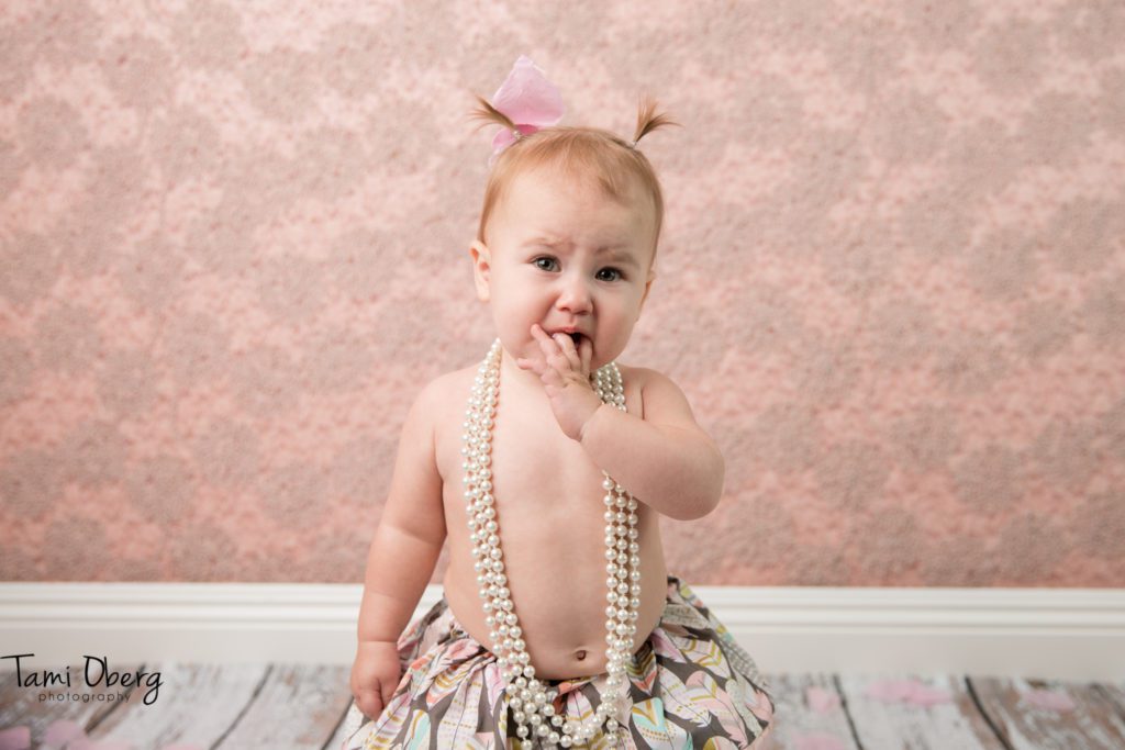 little girl looking sadly into the camera