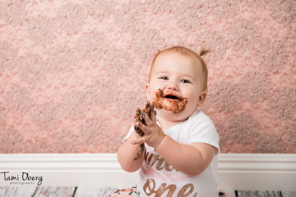 little girl clapping for cake