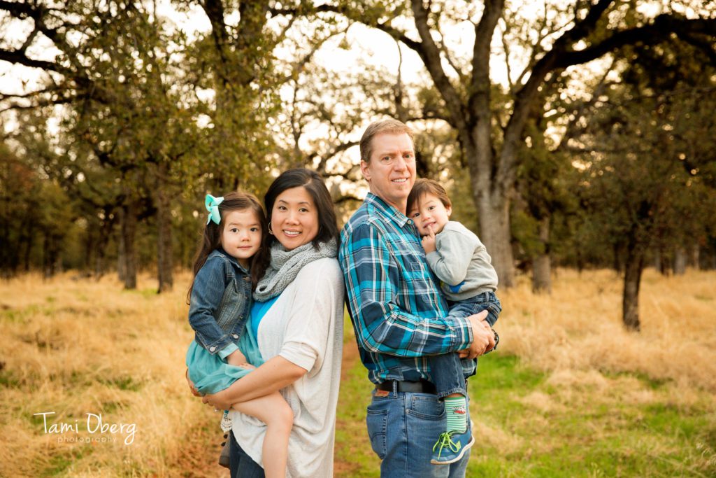 family standing in a field