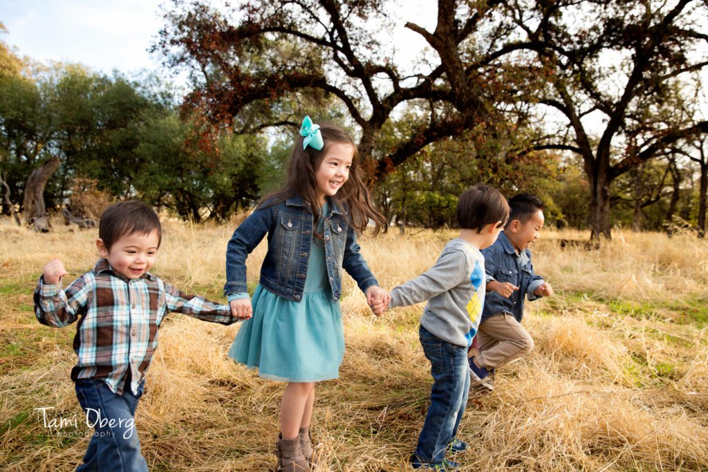 cousins running in a field