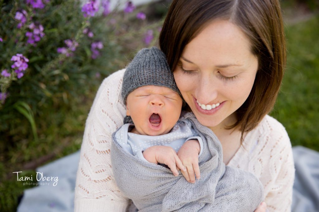 Newborn baby boy yawning